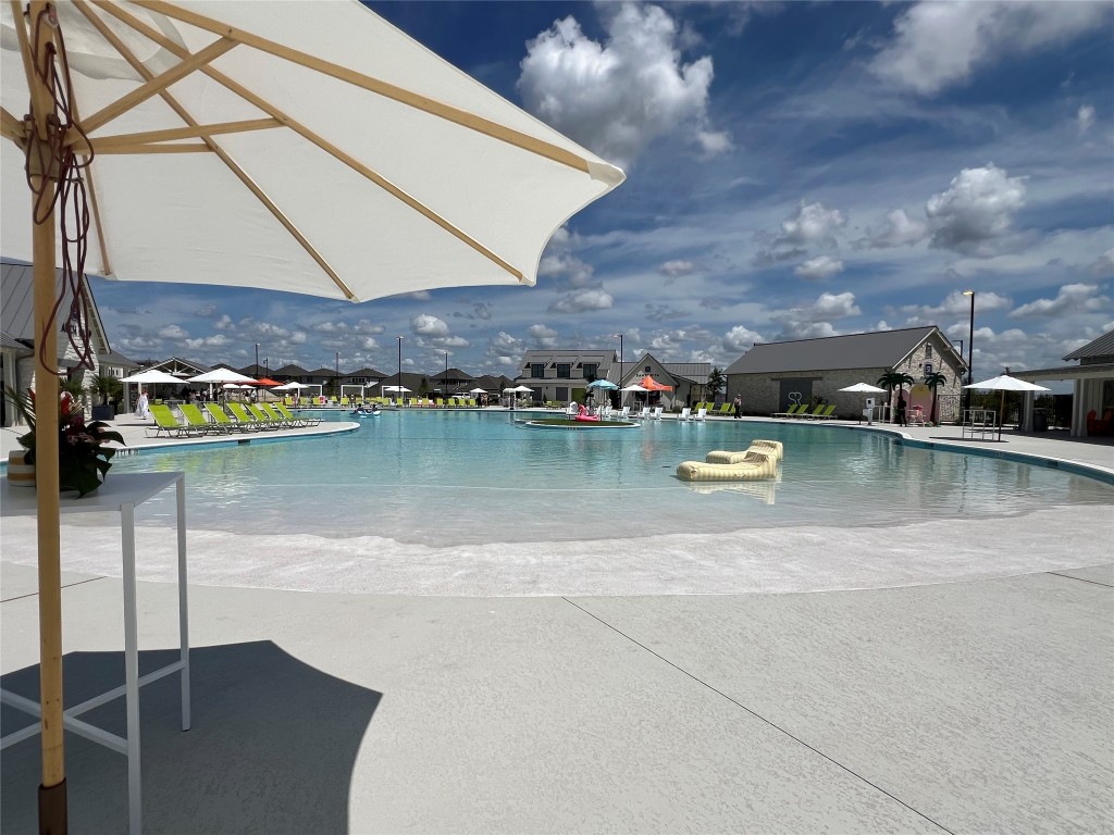 652 Los Olives Lane Georgetown, TX 78628 - Photo 30 of 36 a view of a lake with houses