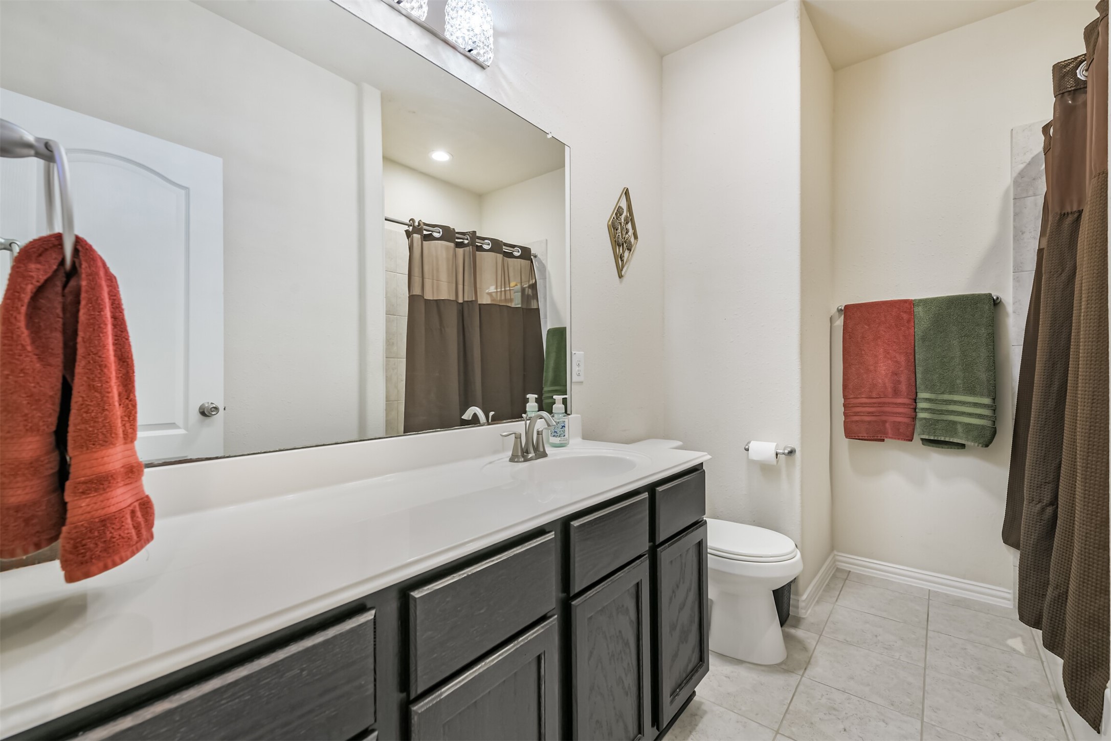 7527 Windsor Valley Lane Houston, TX 77049 - Photo 28 of 35 a bathroom with a sink a toilet and shower