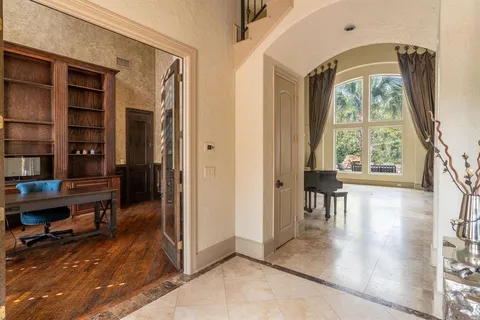 a view of a livingroom with furniture and a window