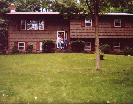 a view of a brick house with a yard