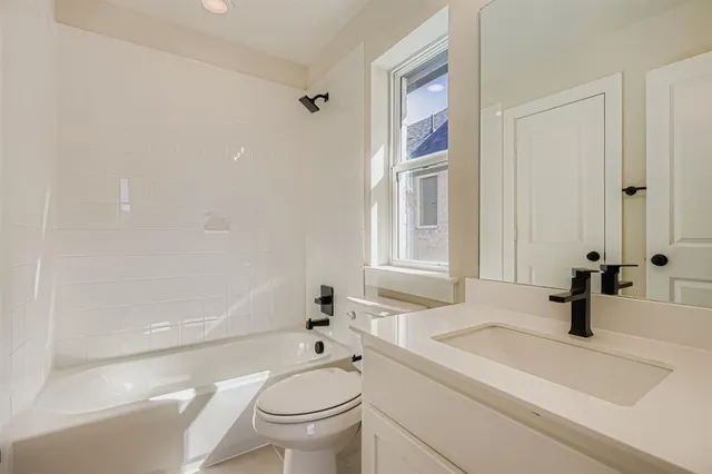 a bathroom with a sink a toilet and a bathtub