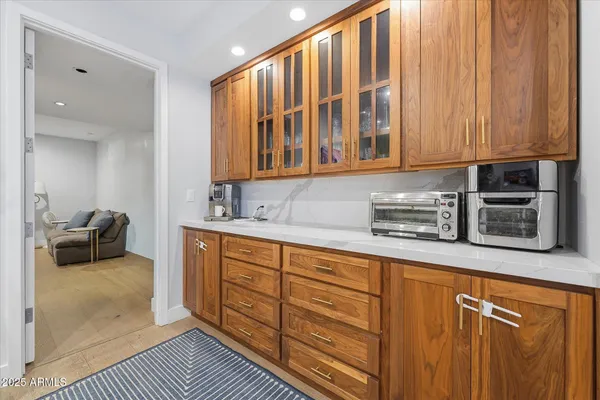 a living room with a large bed and a large window