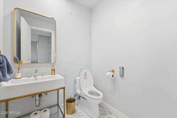 a bathroom with a sink a mirror and a bathtub