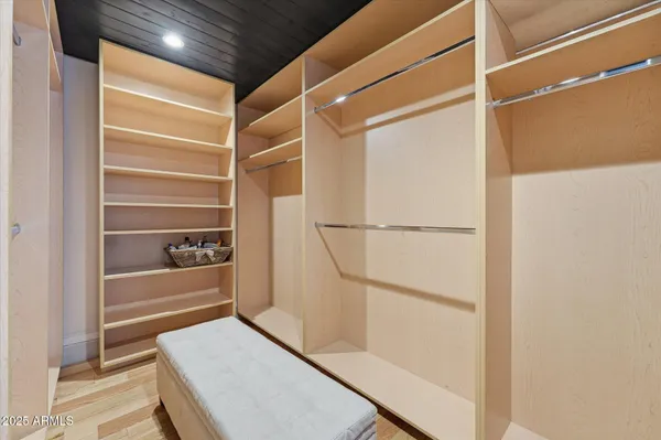 a living room with furniture and large windows