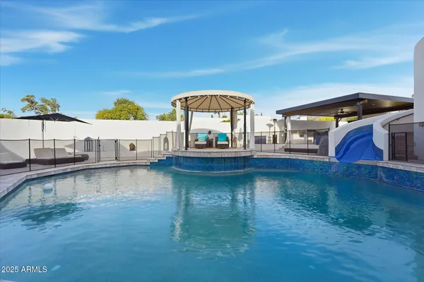 a bathroom with a granite countertop sink mirror and double