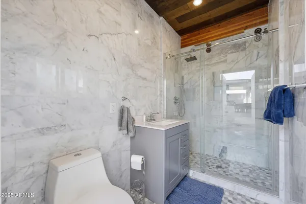 a view of a patio with dining table and chairs