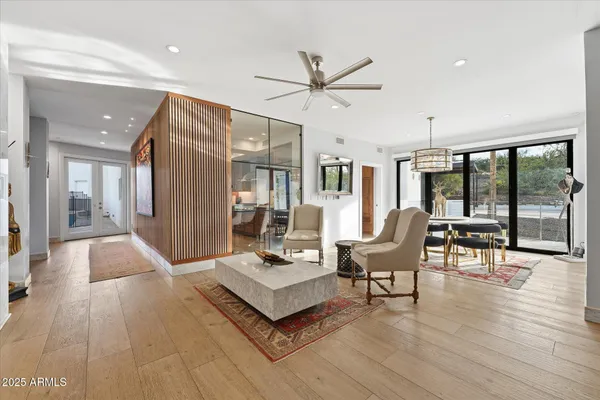 a view of a dining room with furniture window and wooden floor