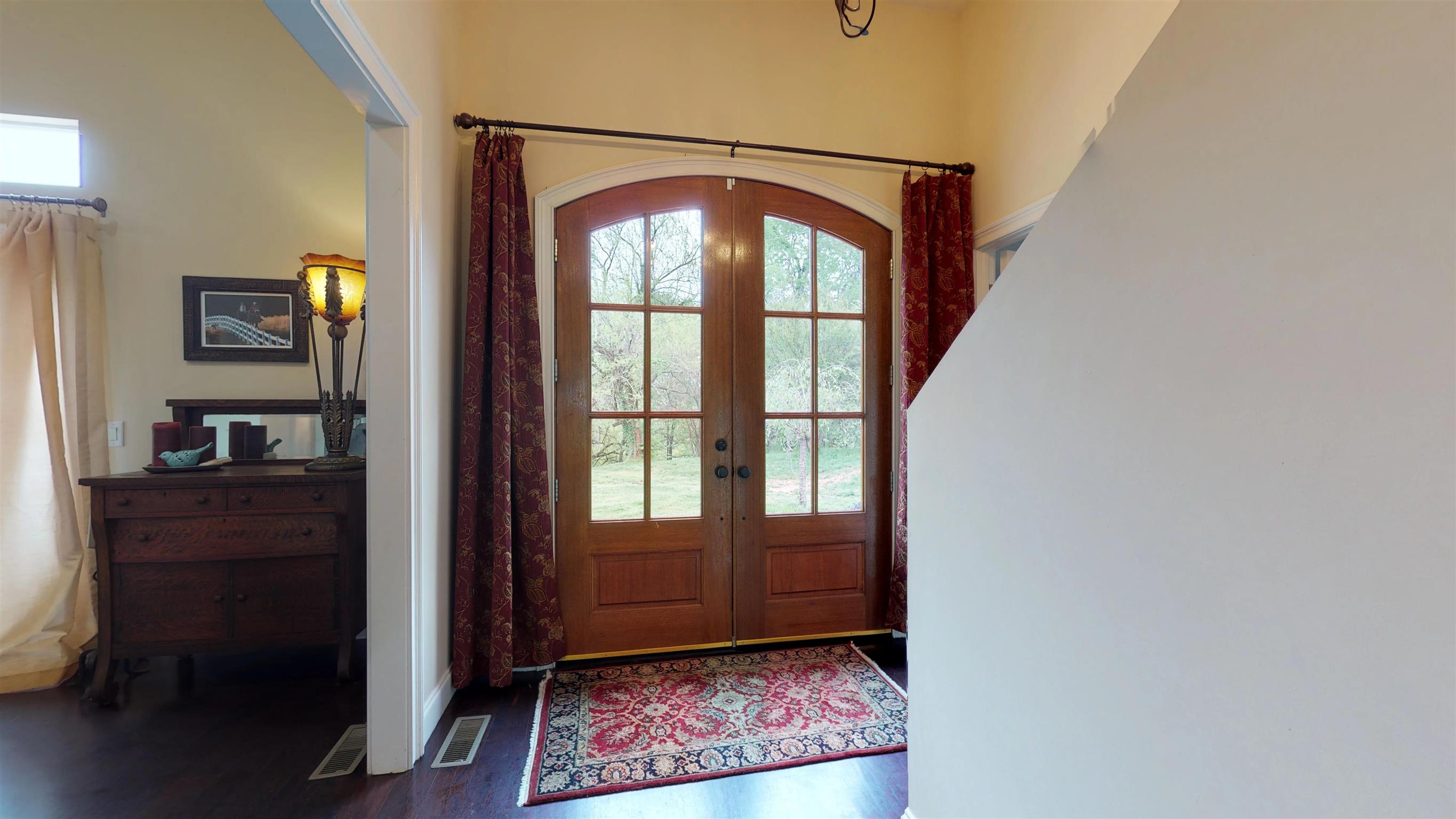 Lovely segmented French doors open to Foyer and 11 foot ceilings throughout