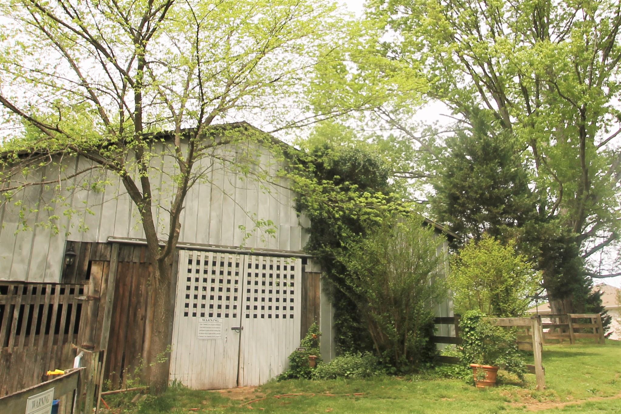 2452 Darks Mill Road Columbia, TN 38401 - Photo 25 of 30 Horse barn has 4-6 stalls, tack and feed room and even a chandelier!