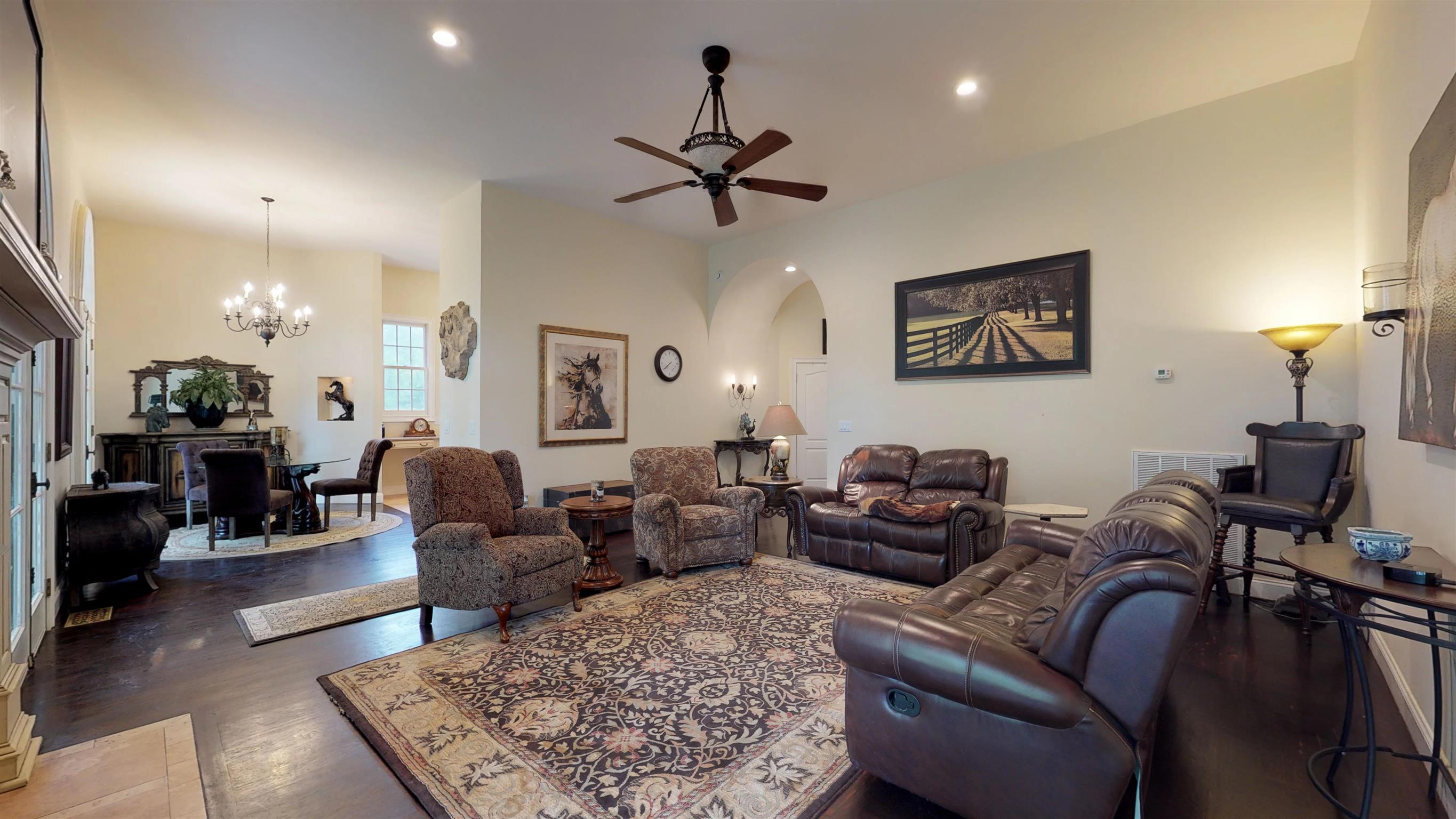 Great room opens to Breakfast room with triple french doors opening to porch for entertaining