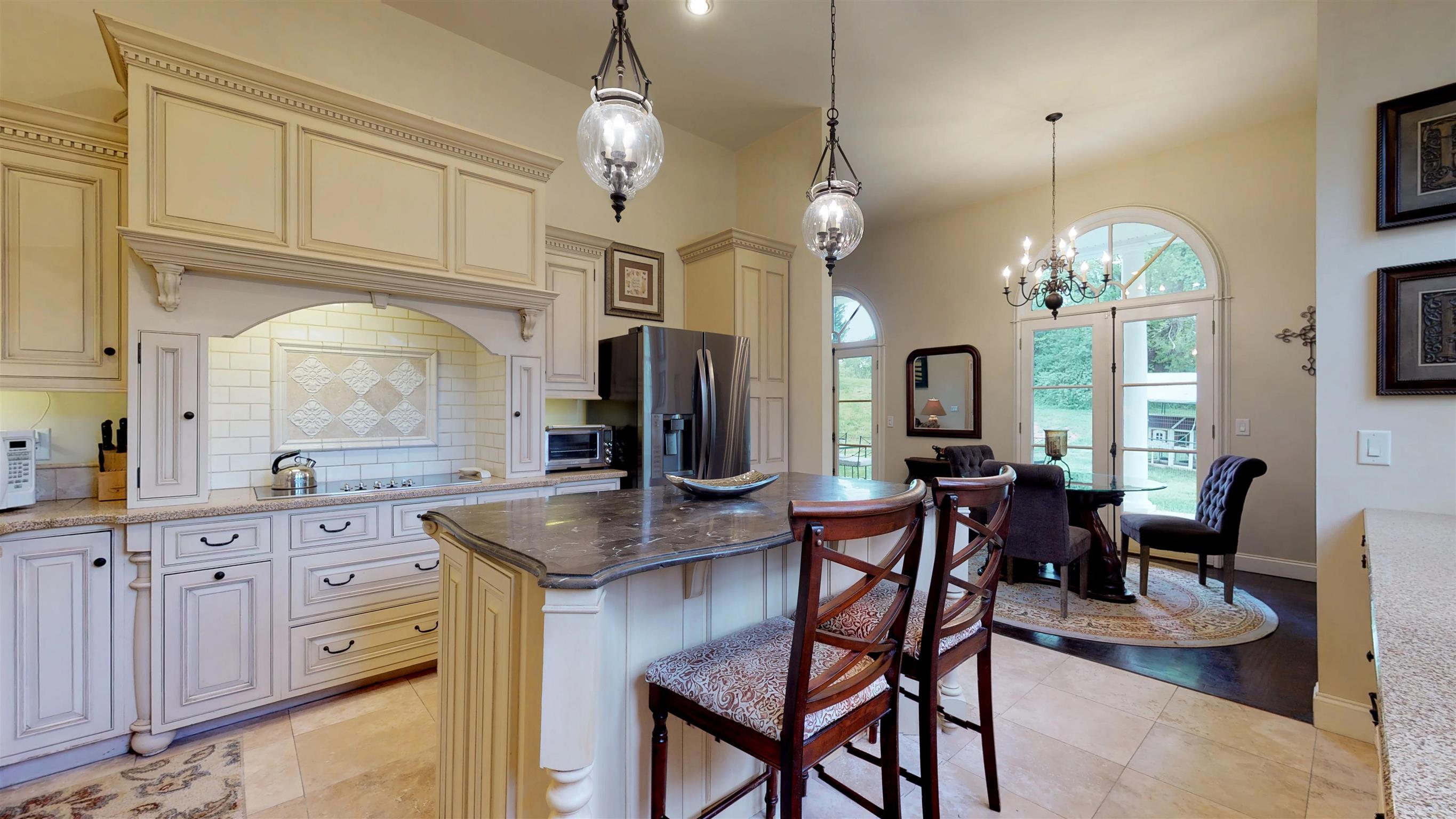 2452 Darks Mill Road Columbia, TN 38401 - Photo 10 of 30 Custom handcrafted cabinets by Plato have many upgraded features like this cooktop surround with pull out spice rack