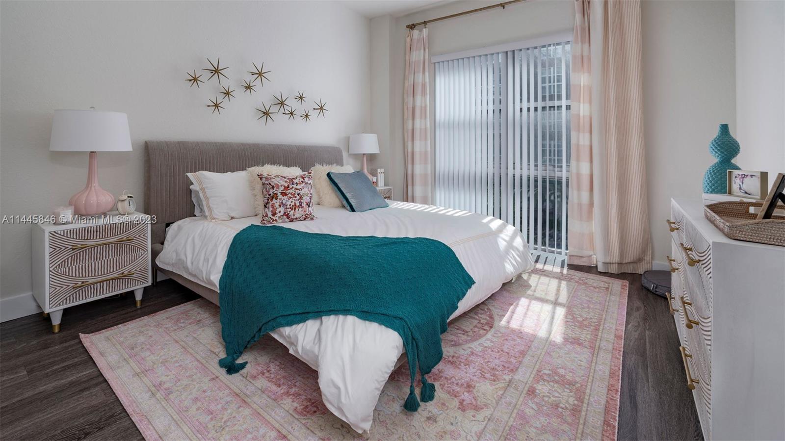 2701 Biscayne Boulevard, Unit 4111 Miami, FL 33137 - Photo 12 of 45 a bedroom with a bed and a painting on the wall