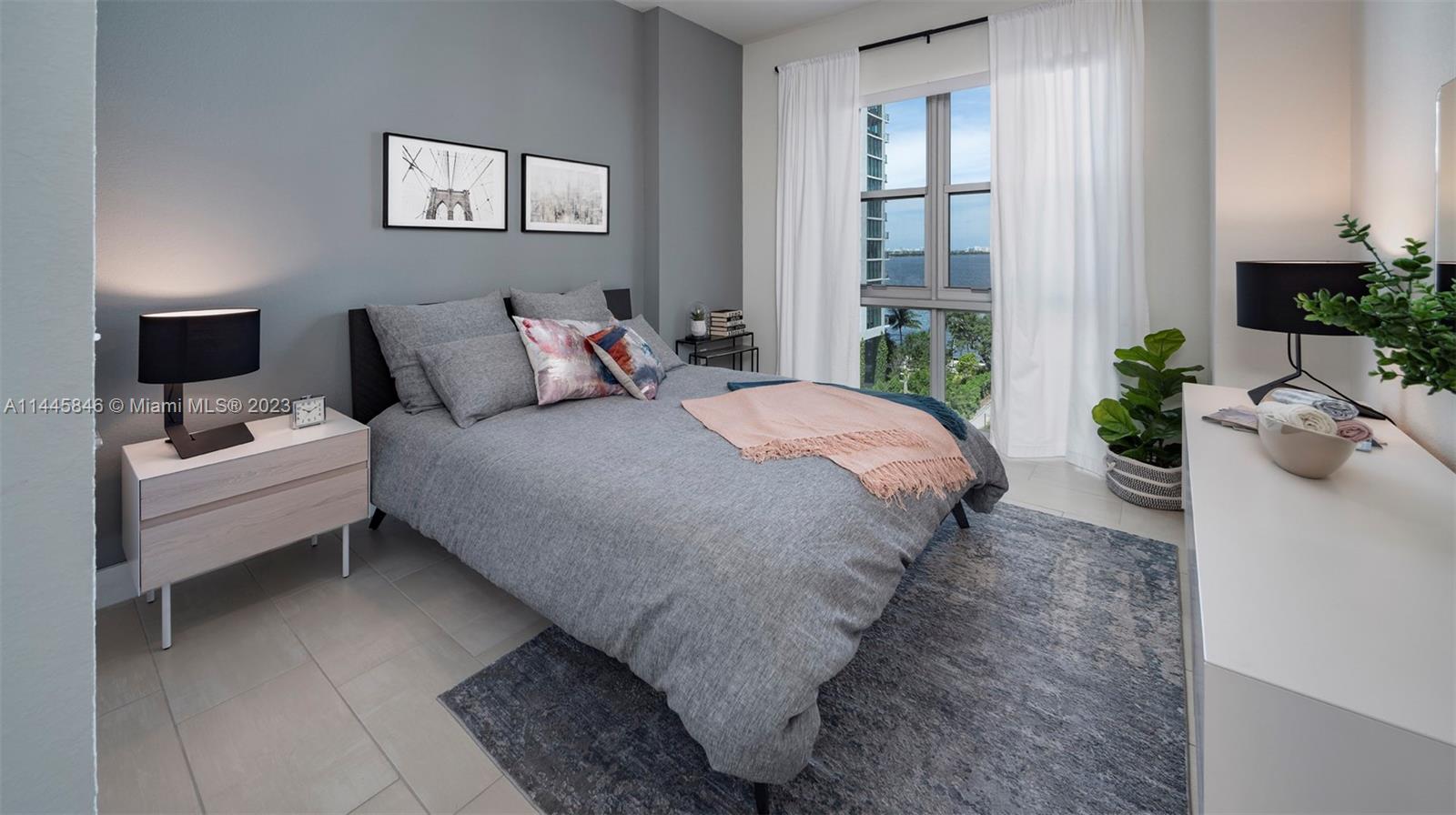 2701 Biscayne Boulevard, Unit 4111 Miami, FL 33137 - Photo 14 of 45 a bedroom with bed and a window