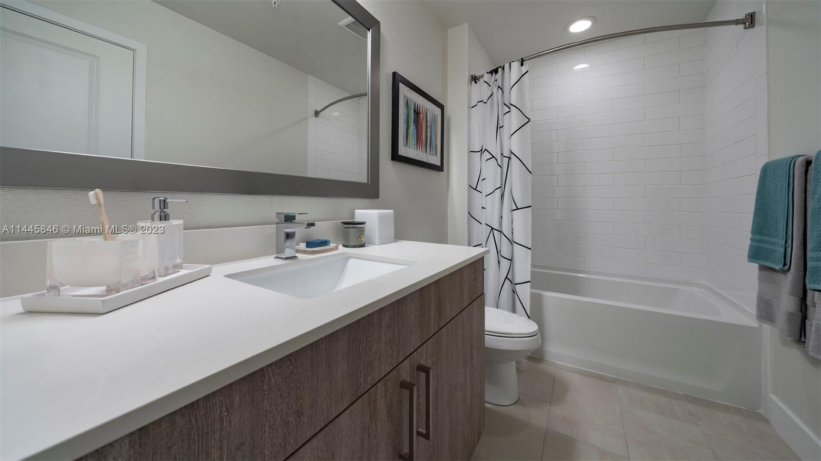 2701 Biscayne Boulevard, Unit 4111 Miami, FL 33137 - Photo 18 of 45 a bathroom with a sink a toilet and shower