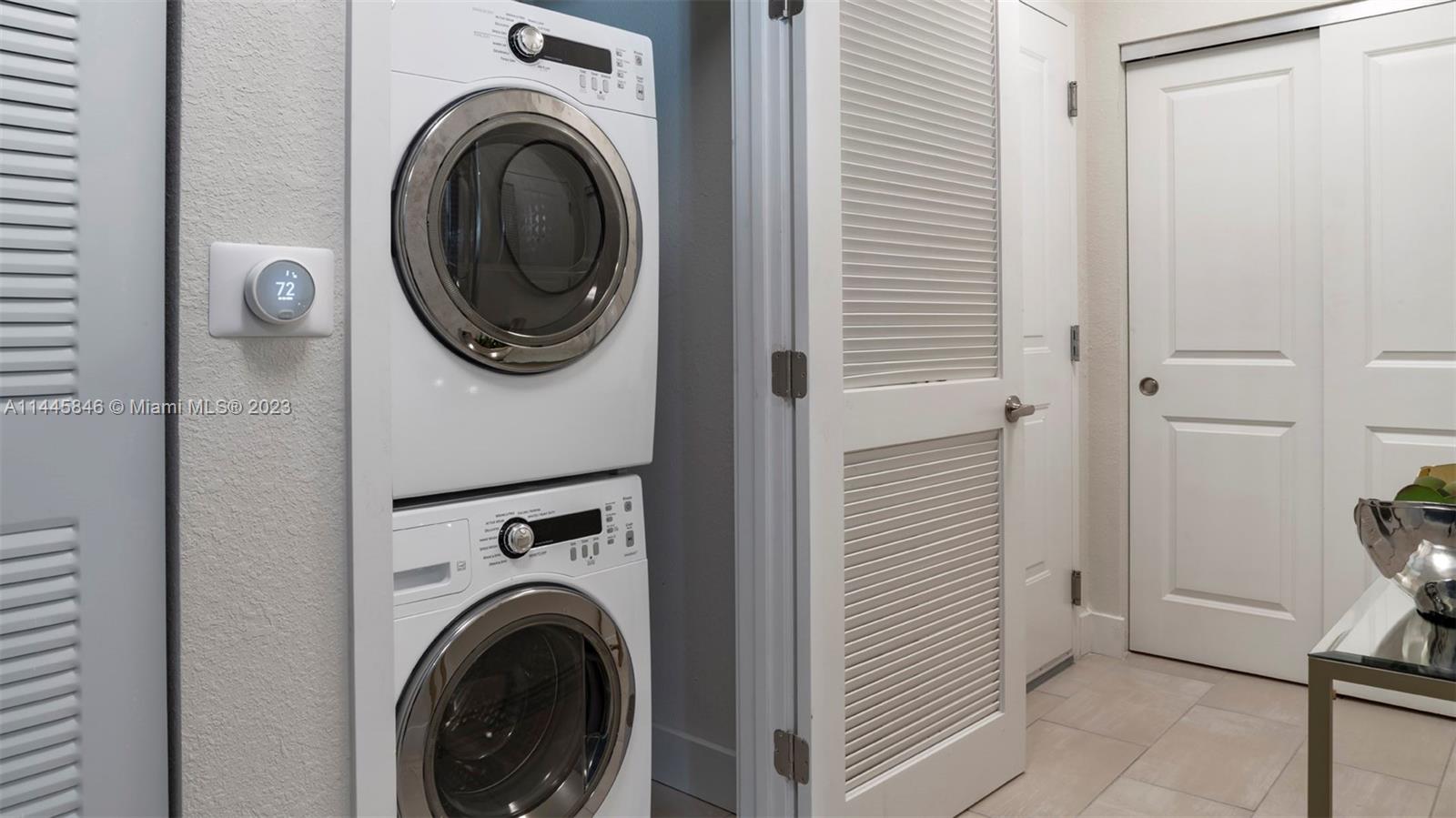 2701 Biscayne Boulevard, Unit 4111 Miami, FL 33137 - Photo 33 of 45 a view of a hallway with washer and dryer
