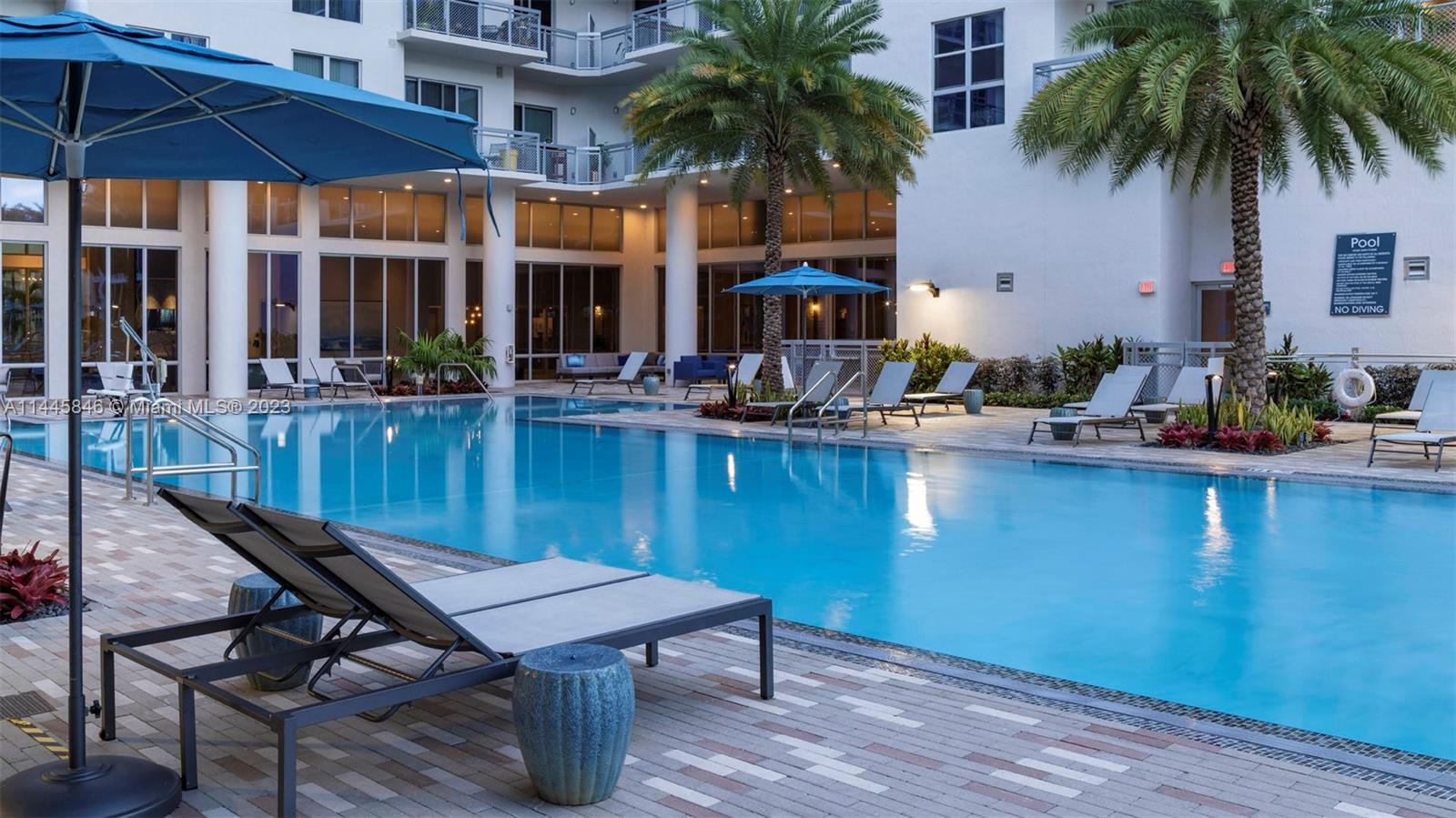 2701 Biscayne Boulevard, Unit 4111 Miami, FL 33137 - Photo 42 of 45 a view of a house with pool and chairs