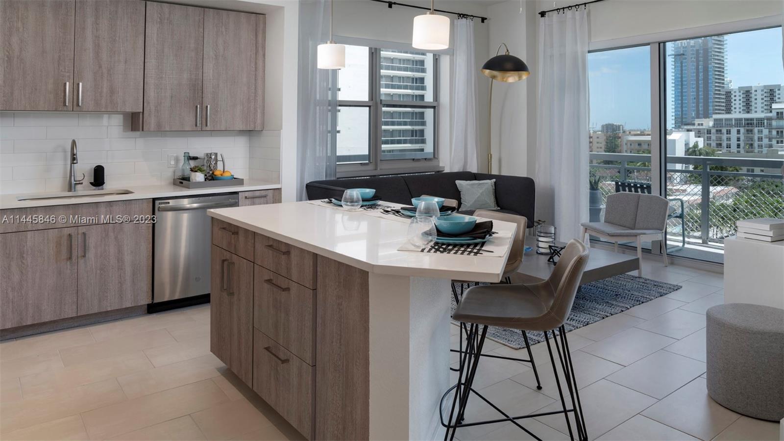 2701 Biscayne Boulevard, Unit 4111 Miami, FL 33137 - Photo 7 of 45 a kitchen with a sink cabinets and window