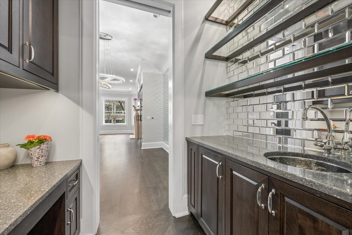 458 West Deming Place Chicago, IL 60614 - Photo 11 of 39 a kitchen with granite countertop a sink and cabinets