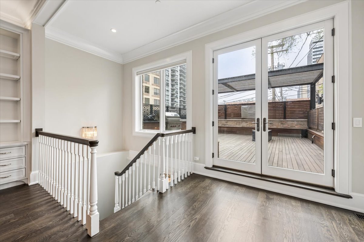 458 West Deming Place Chicago, IL 60614 - Photo 14 of 39 a view of a room with wooden floor and windows