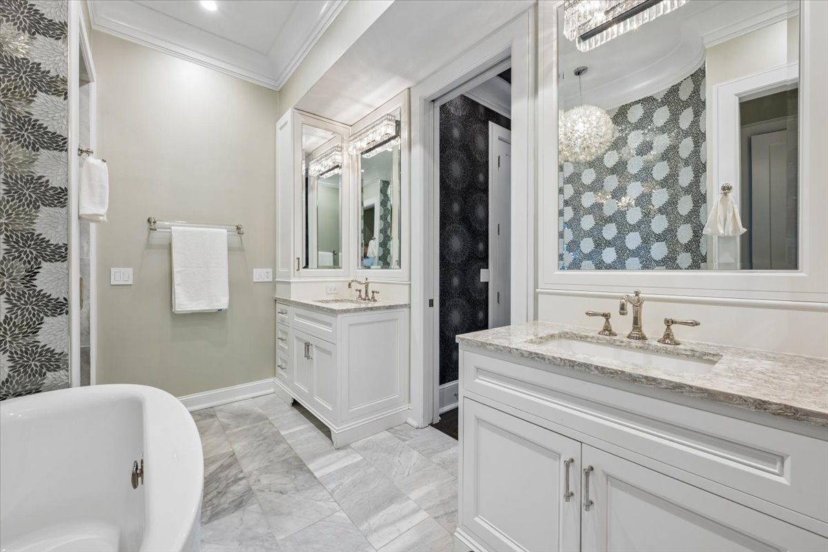 458 West Deming Place Chicago, IL 60614 - Photo 17 of 39 a bathroom with a sink and a mirror
