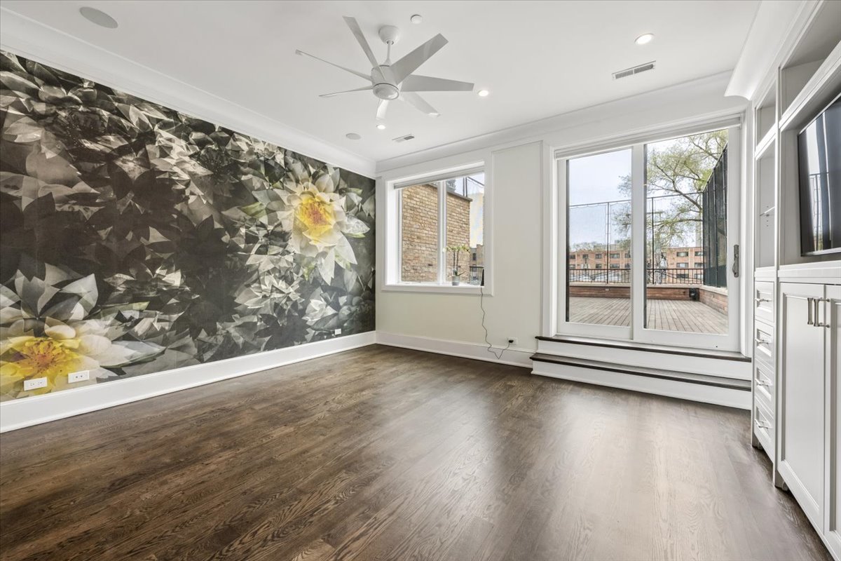 458 West Deming Place Chicago, IL 60614 - Photo 19 of 39 an empty room with wooden floor and windows