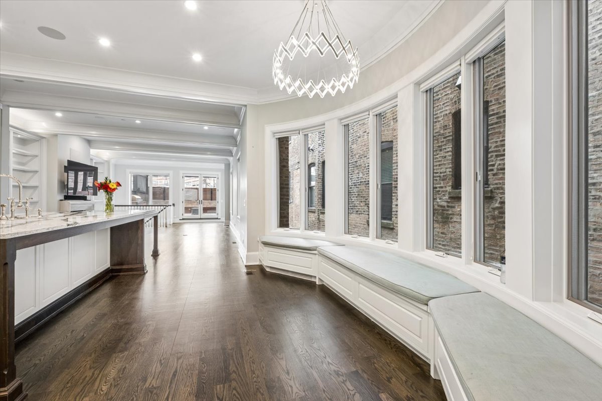 458 West Deming Place Chicago, IL 60614 - Photo 8 of 39 a living room with hardwood floor and a kitchen