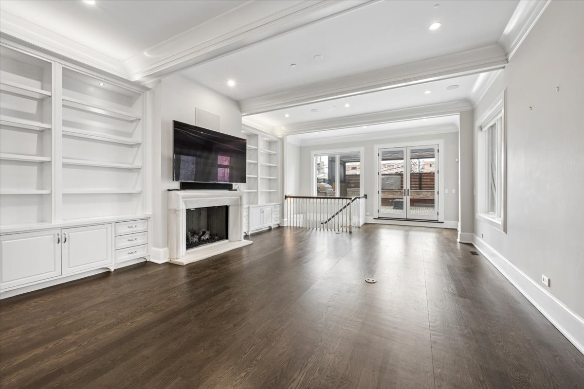 458 West Deming Place Chicago, IL 60614 - Photo 10 of 39 a view of a livingroom with wooden floor and a fireplace