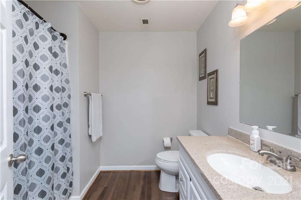 310 West Rambo Road Rock Hill, SC 29730 - Photo 18 of 26 a bathroom with a granite countertop toilet and a sink