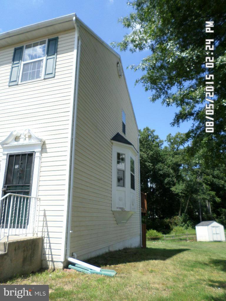 3520 Corn Stream Road Randallstown, MD 21133 - Photo 2 of 16 a front view of a house with a yard