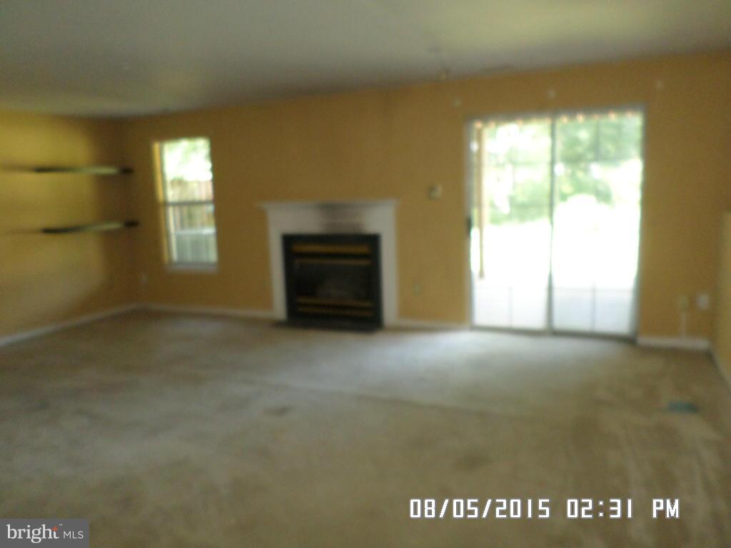 3520 Corn Stream Road Randallstown, MD 21133 - Photo 14 of 16 a view of empty room with a fireplace