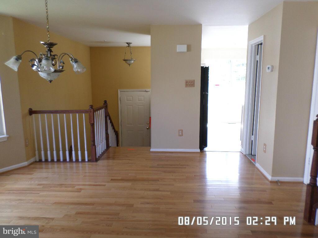 3520 Corn Stream Road Randallstown, MD 21133 - Photo 3 of 16 a view of a furniture in hallway with wooden floor