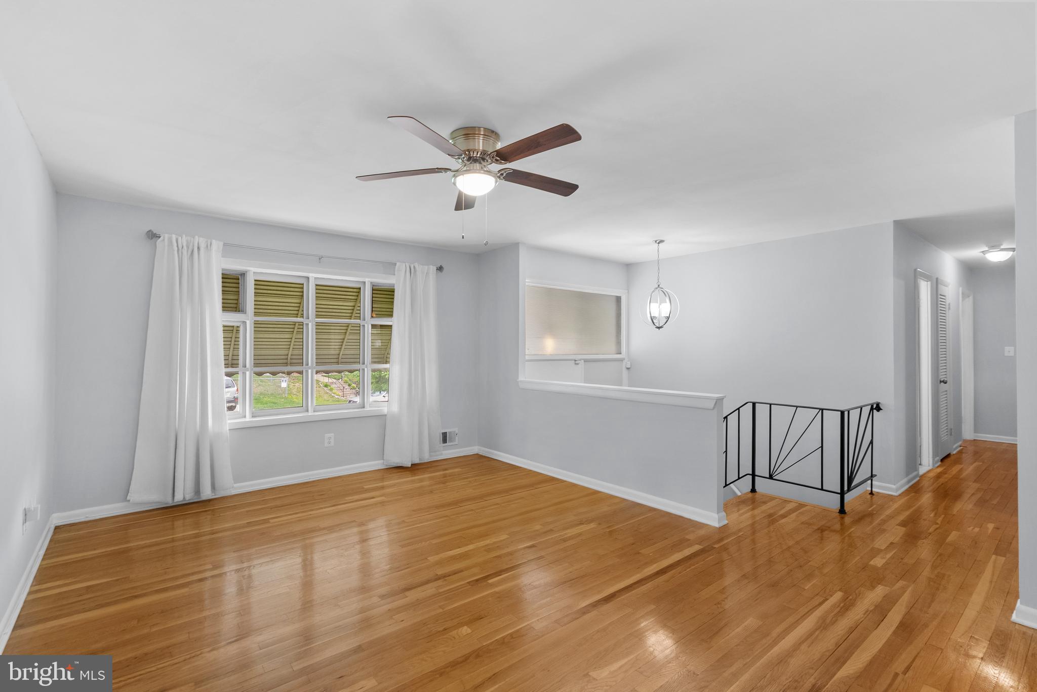 1201 Chillum Manor Road Hyattsville, MD 20783 - Photo 9 of 49 a view of an empty room with a window