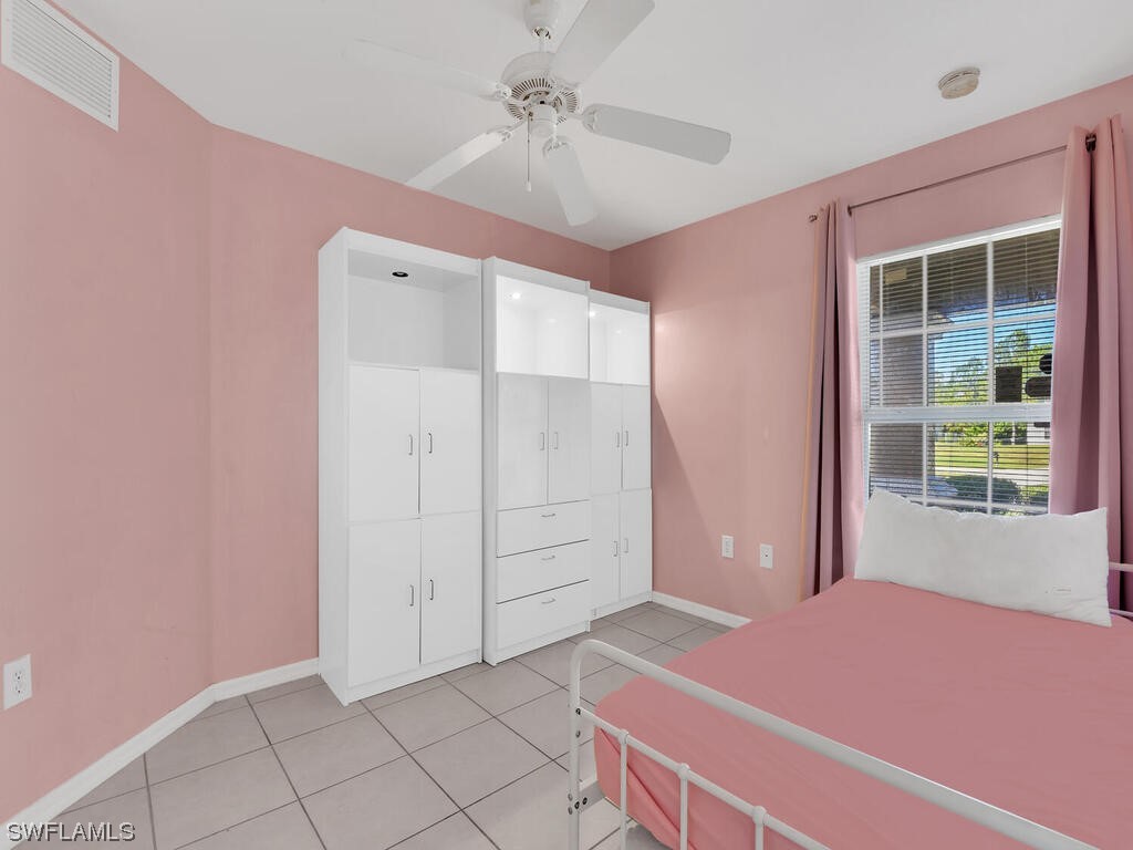 3960 Sunset Road Lehigh Acres, FL 33971 - Photo 11 of 23 a bedroom with a bed and a window