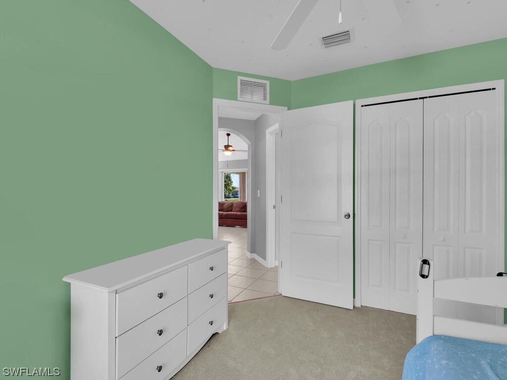 3960 Sunset Road Lehigh Acres, FL 33971 - Photo 16 of 23 a view of room with cabinets and wooden floor