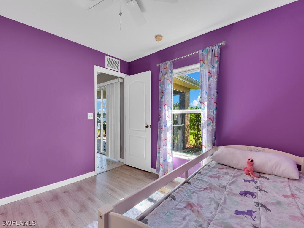 3960 Sunset Road Lehigh Acres, FL 33971 - Photo 18 of 23 a bedroom with a bed and a window