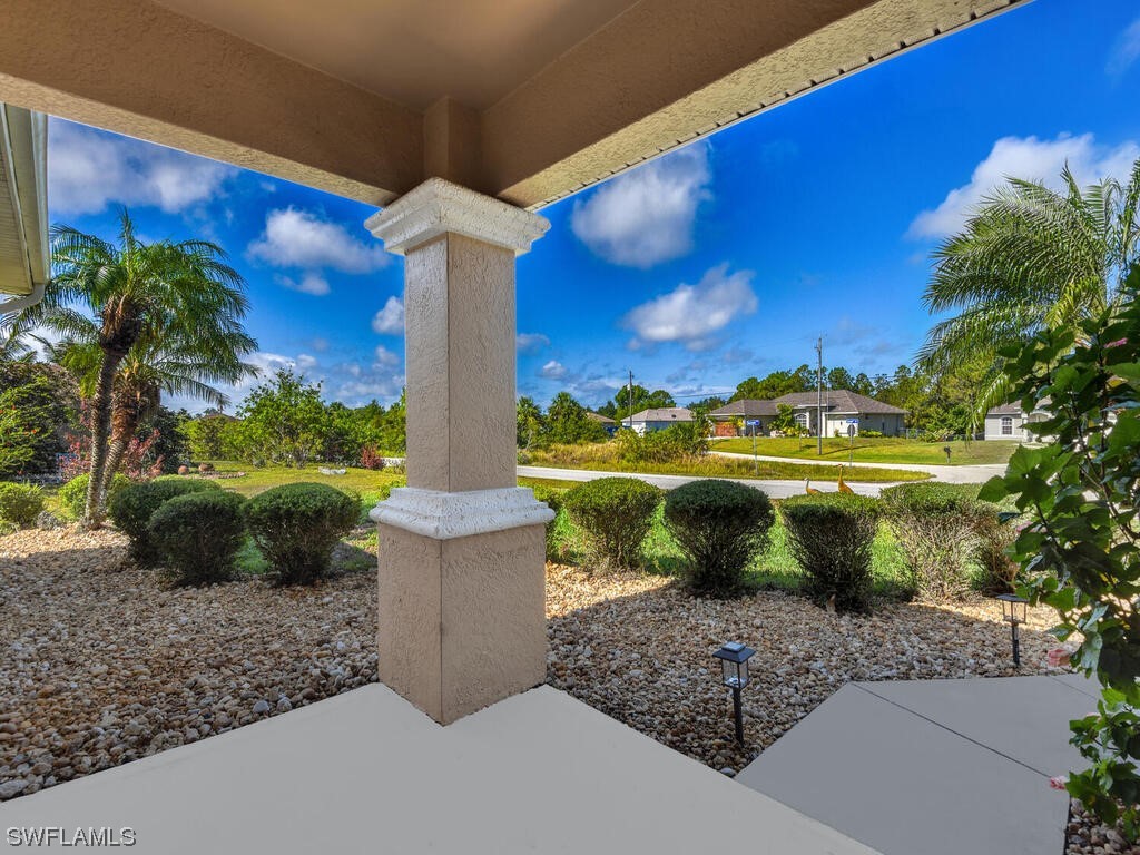 3960 Sunset Road Lehigh Acres, FL 33971 - Photo 2 of 23 a view of a terrace with a garden