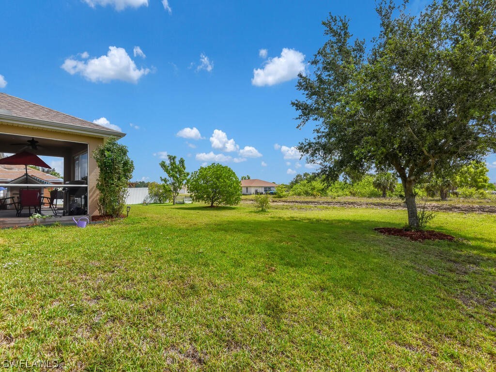 3960 Sunset Road Lehigh Acres, FL 33971 - Photo 23 of 23 a view of a house with a backyard