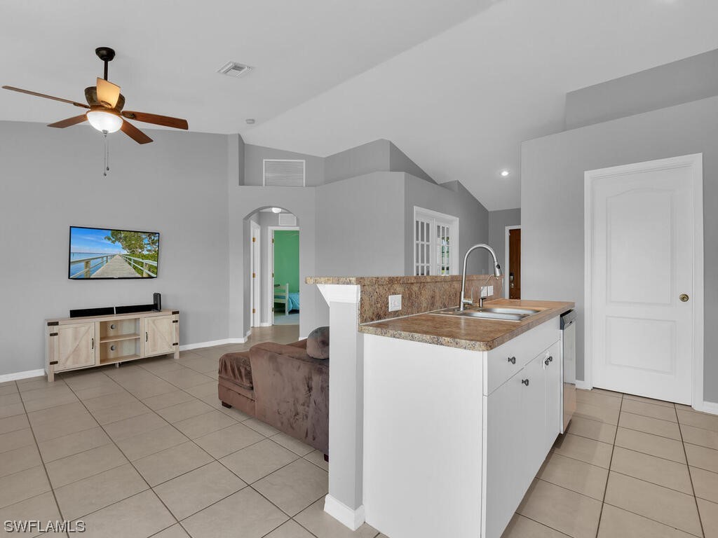 3960 Sunset Road Lehigh Acres, FL 33971 - Photo 6 of 23 a view of living room with furniture and flat screen tv