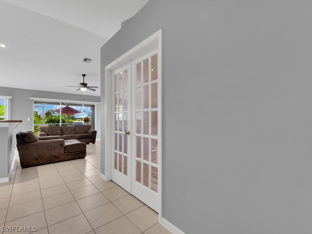 3960 Sunset Road Lehigh Acres, FL 33971 - Photo 7 of 23 a living room with furniture and a flat screen tv