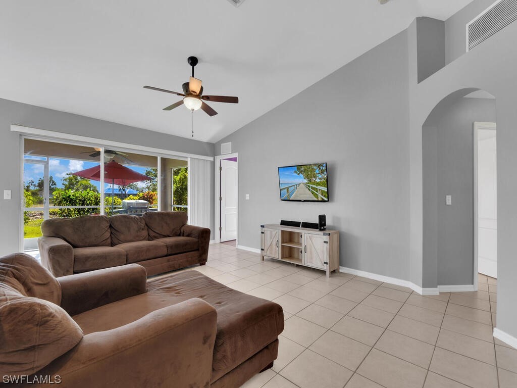 3960 Sunset Road Lehigh Acres, FL 33971 - Photo 8 of 23 a living room with furniture and a flat screen tv