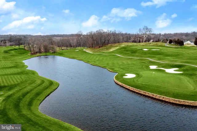 a view of a golf course with a yard