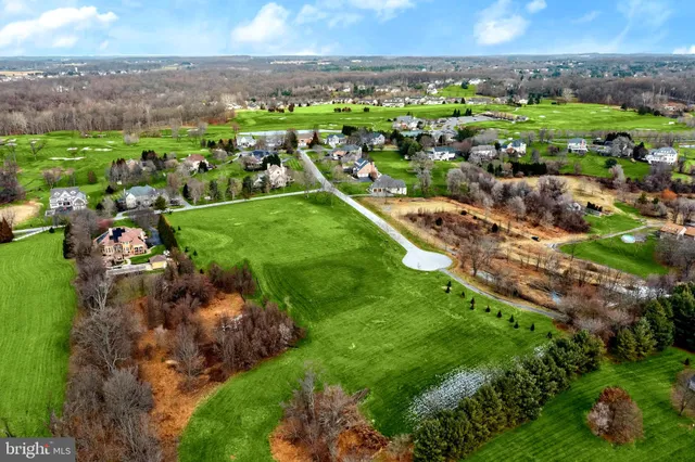 a view of a lake with houses in the back