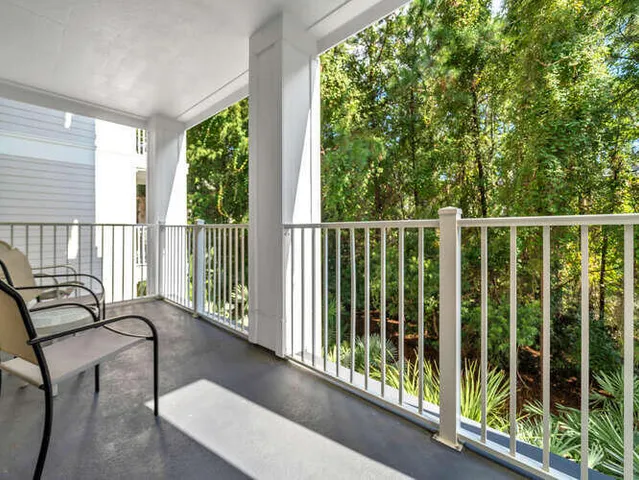 a view of balcony with furniture