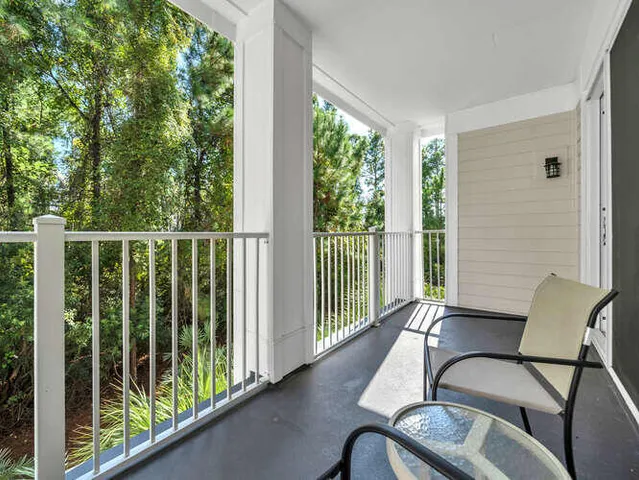 a view of a balcony with furniture