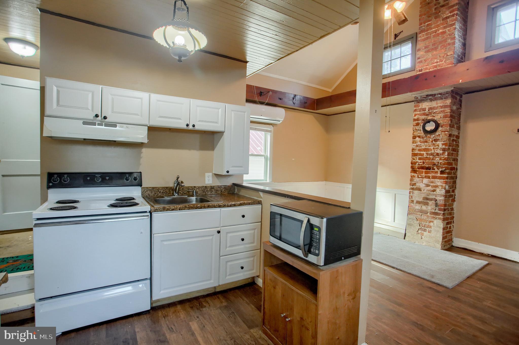 303 South Ridge Road Carlisle, PA 17015 - Photo 28 of 47 Guest house kitchen w/ stairs leading to bath
