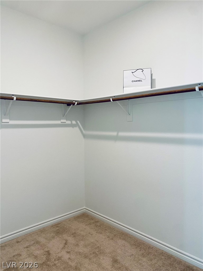 4457 Sawyer Ridge Street Las Vegas, NV 89147 - Photo 24 of 32 Functional closet space provides ample storage with integrated shelving and hanging rods.