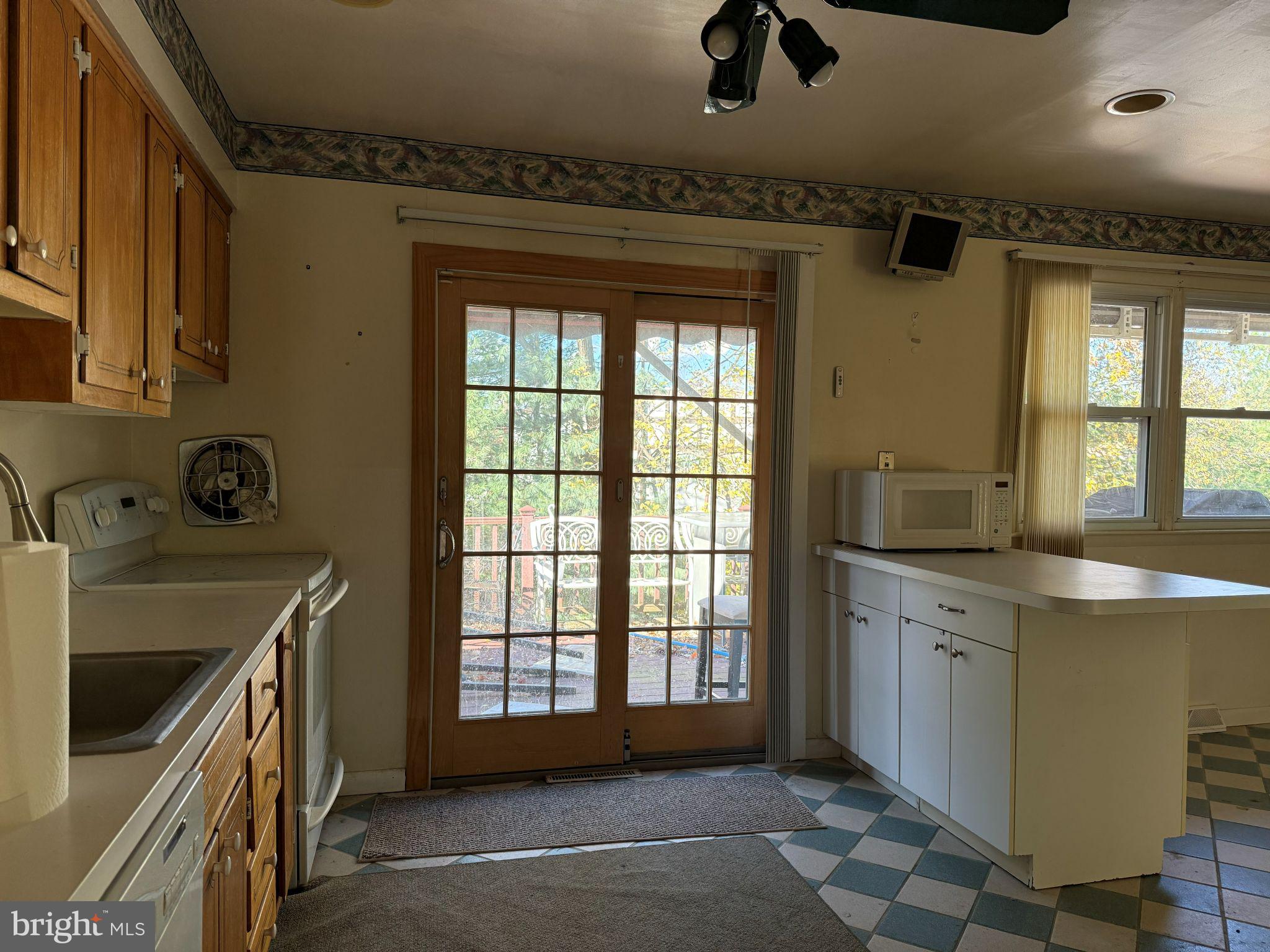 916 Edgemoor Road Cherry Hill, NJ 08034 - Photo 8 of 33 a kitchen with a sink a stove and a refrigerator