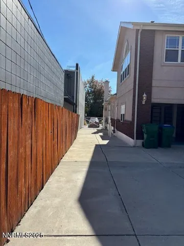 a view of backyard with patio