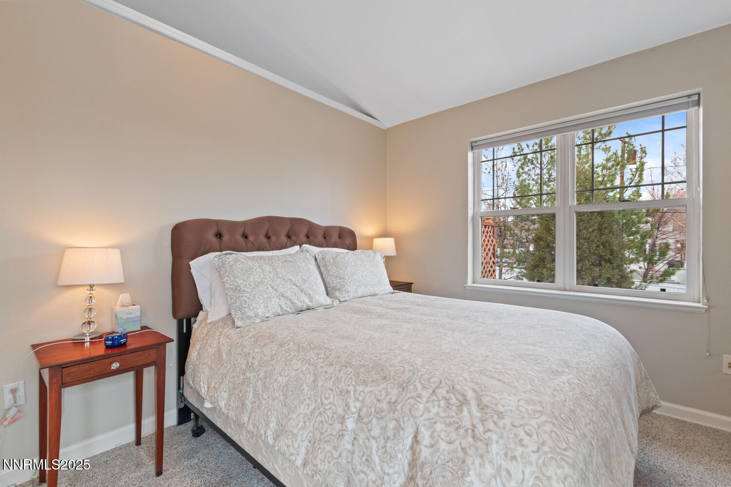 543 California Avenue Reno, NV 89509 - Photo 5 of 17 a bedroom with a bed and a lamp