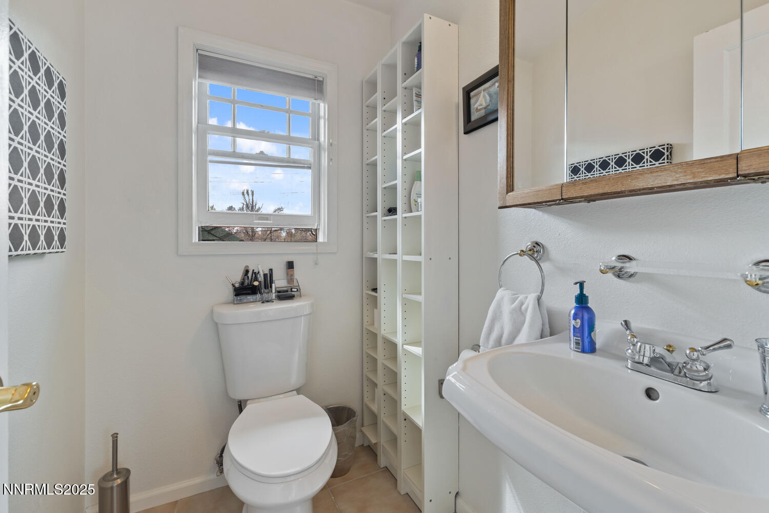 543 California Avenue Reno, NV 89509 - Photo 9 of 17 a white toilet sitting next to a bathroom sink